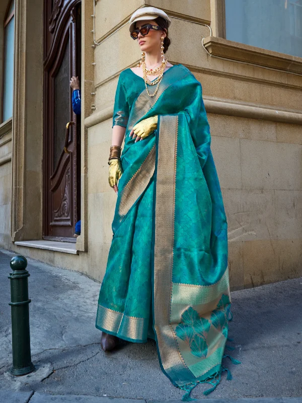 Women's Organza Teal blue Woven Design Designer Saree With Blouse Piece Airy Cotton Blouse Women's Organza Teal blue Woven Design Designer Saree With Blouse Piece Airy Cotton Blouse